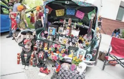  ?? MELISSA FOSSUM/SPECIAL FOR THE REPUBLIC ?? This car looked awesome during Día de los Muertos at Saint Mary’s Basilica in Phoenix on Sunday, Nov. 4, 2018.