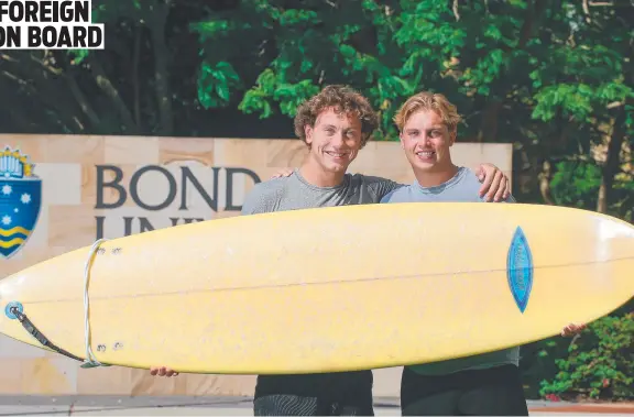  ?? ?? Bond University students Zach Holmstrom and Matthew Wright are taking to the Gold Coast surfing lifestyle. Picture: Glenn Campbell