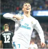  ?? Paul White/ Associated Press
file photo ?? Cristiano Ronaldo celebrates Real Madrid’s 2nd
goal during the Champions League soccer match, round of 16, 1st leg between Real Madrid and Paris Saint Germain on Feb. 14 at the Santiago Bernabeu stadium
in Madrid.