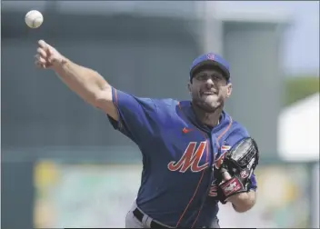  ?? SUE OGROCKI/AP ?? NEW YORK METS’ MAX SCHERZER pitches in the second inning of a spring training game against the Miami Marlins, Monday in Jupiter, Fl.