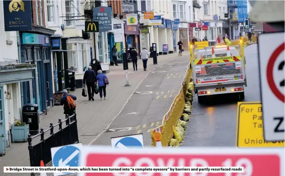  ??  ?? Bridge Street in Stratford-upon-Avon, which has been turned into “a complete eyesore” by barriers and partly resurfaced roads