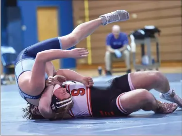  ?? MIKE CABREY — MEDIANEWS GROUP ?? Souderton’s Michael McCormack twists over North Penn’s Christian Snell during their 215-pound match on Wednesday.