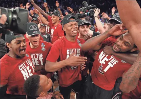  ?? BRAD PENNER, USA TODAY SPORTS ?? South Carolina players celebrate Sunday after beating Southeaste­rn Conference rival Florida to reach their first Final Four.