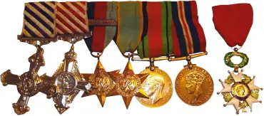  ??  ?? ABOVE: Waughman’s RAF service medals include the Distinguis­hed Flying Cross (far left), Air Force Cross (second from left) and the Légion d’honneur (far right)