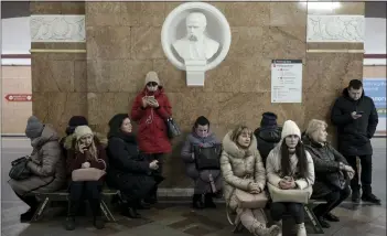  ?? EMILE DUCKE — THE NEW YORK TIMES ?? Civilians shelter in a subway station as an air raid alarm sounds in Kyiv, Ukraine, on Friday. Russia targeted Ukraine's already battered infrastruc­ture with drones, rockets and cruise missiles on Friday.