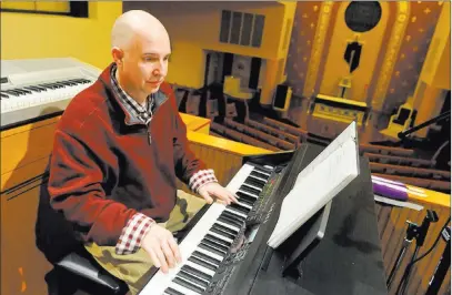  ?? Jason Farmer ?? The Times-tribune via AP Scott Coates, 48, absorbed music from his piano-playing dad when he was just a boy. He’s been making music and leading choirs ever since, and is now organist at St. Eulalia’s Church in Roaring Brook Township, Pa.