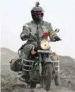  ?? ALISA CLICKENGER/AP ?? Clickenger riding her motorcycle in India, descending the mountains headed for Manali.