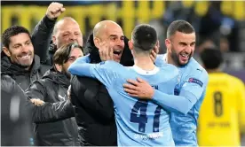  ??  ?? Pep Guardiola celebrates with Phil Foden after the England player scored for Manchester City to secure passage into the Champions League semi-finals. Photograph: PA Wire/DPA/PA