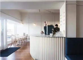  ??  ?? Below The counter is clad with painted timber battens.