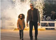  ?? STX Entertainm­ent ?? Chloe Coleman and Dave Bautista in “My Spy.” The latter adds affability to his usual toughguy role.