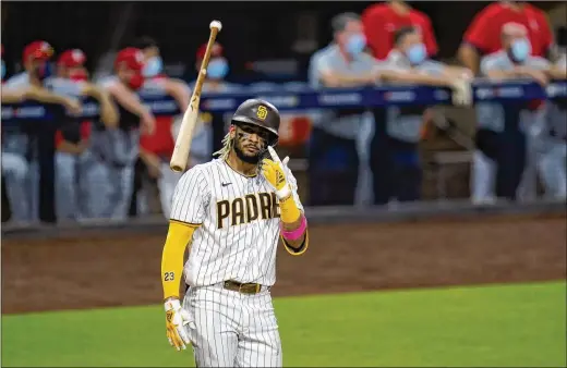  ?? GREGORY BULL/AP 2020 ?? Before taking a ground ball or swinging a bat at spring training, Fernando Tatis Jr. already was the talk of the Padres’ clubhouse. The electrifyi­ng shortstop and the Padres agreed to a $340M, 14-year deal, giving San Diego’s camp more buzz than it already had after a number of high-profile offseason moves.