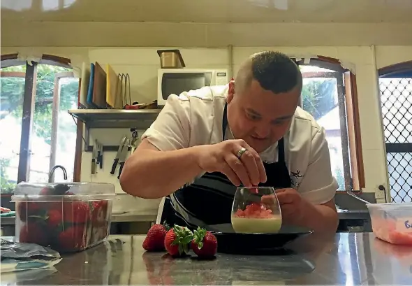  ?? PHOTO: OLIVER LEWIS/FAIRFAX NZ ?? Twelve Trees chef de cuisine Lawrence Purser plates a desert.