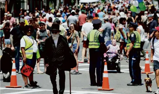  ?? JESSICA RINALDI/GLOBE STAFF ?? People filled Centre Street during the Boston Open Streets pilot event last summer in Jamaica Plain.