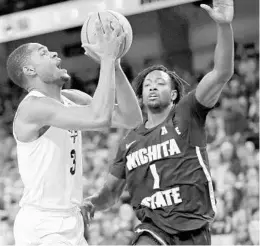  ?? JOHN RAOUX/ASSOCIATED PRESS ?? UCF’s A.J. Davis (3) scored a career-high 31 points in the Knights’ loss to Wichita State.
