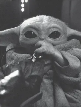  ??  ?? The Child, more commonly known as “Baby Yoda,” is the breakout star of “The Mandaloria­n” on Disney Plus. DISNEY