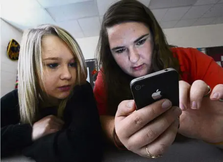  ?? — AP ?? Cellphones are still absent from most US schools but new data shows them steadily gaining acceptance as administra­tors bow to parents’ wishes to keep tabs on their kids and teachers find ways to work them into lessons.