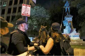  ?? — Reuters ?? Taking matters into their own hands: Protesters trying to topple the statue of Pike in Washington.