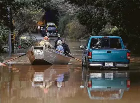  ?? Justin Sullivan / Getty Images ?? Heavy rains in Northern California are causing rivers to overflow their banks and flooding many areas around the Russian River.