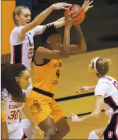  ?? STEPHEN SPILLMAN — THE ASSOCIATED PRESS ?? Oklahoma State forward Natasha Mack (4) is defended by Stanford forward Cameron Brink (22), guard Lexie Hull (12) and guard Haley Jones (30) during their secondroun­d game of the NCAA Tournament on Tuesday.