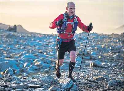  ??  ?? David Wallace of Perthshire battles on to finish the Ultra-Trail Snowdonia challenge in second place.