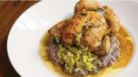  ?? Yi-Chin Lee / Houston Chronicle ?? The Cornish Game Hen is simple and delicious.