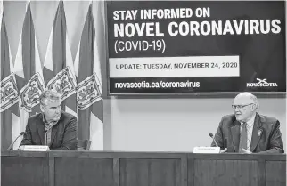  ??  ?? Dr. Robert Strang, Nova Scotia's chief medical officer of health, and Premier Stephen Mcneil, at Tuesday's live COVID-19 briefing.