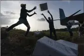  ??  ?? Haitian aid workers unload food from a VM-22 Osprey at Jeremie Airport, Saturday in Jeremie, Haiti.