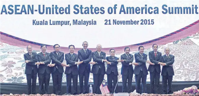  ??  ?? KUALA LUMPUR: US President Barack Obama and other leaders pose for a photo at the end of the US-ASEAN (Associatio­n of Southeast Asian Nations) meeting yesterday. —AP