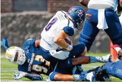  ?? STAFF PHOTO BY DOUG STRICKLAND/TIMES FREE PRESS ?? UTC defensive end Keionta Davis sacks Samford quarterbac­k Devlin Hodges during a SoCon game last month at Finley Stadium. Davis leads the conference with eight sacks this season, and he has 28.5 in his UTC career.