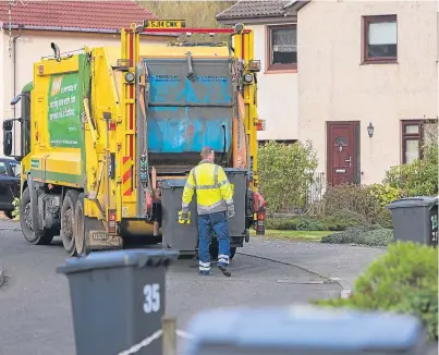  ?? Picture: Steven Brown. ?? Waste collection­s under way on a Fife street.