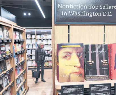  ?? MATT MCCLAIN THE WASHINGTON POST FILE PHOTO ?? In addition to its online juggernaut, Amazon operates 18 retail book stores, including this one in Washington. The company also published 1,231 titles of its own in 2017, up from 373 in 2009, the year it entered the $16-billion-a-year book publishing business.