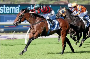  ??  ?? Summer Passage (Blake Shinn) completes a Group One double for trainers Lance O’Sullivan and Andrew Scott in the Sistema Stakes at Ellerslie.