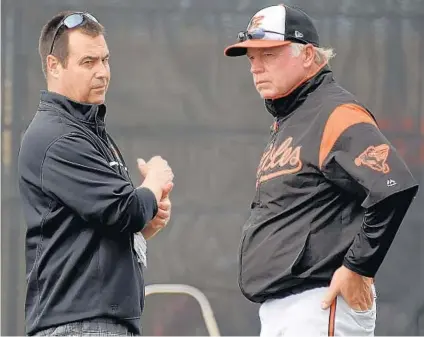  ?? KARL MERTON FERRON/BALTIMORE SUN ?? Executive vice president Dan Duquette and manager Buck Showalter are balancing keeping the Orioles competitiv­e while preparing for the future.