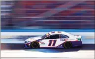  ?? Jared C. Tilton / Getty Images ?? Denny Hamlin drives during practice on Friday for the NASCAR Cup Series Championsh­ip at Phoenix Raceway in Avondale, Ariz.