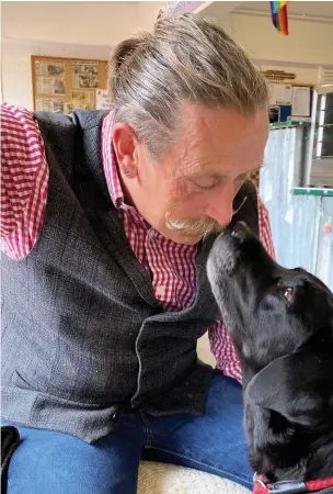  ??  ?? ● Dr Tony John with his pet labrador George