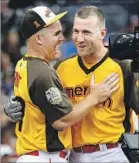  ?? Lenny Ignelzi Associated Press ?? TWO-TIME All-Star MVP Mike Trout, left, and 2015 home run derby champion Todd Frazier share a laugh at Petco Park.