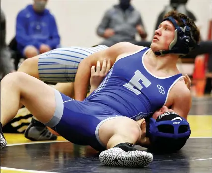  ?? PHOTOS BY GEORGE SPITERI — THE MACOMB DAILY ?? Justin Labon of Eisenhower works toward a pin during a match against Lakeview at Roseville on Wednesday. Labon went 3-0during the MAC Blue quad meet.