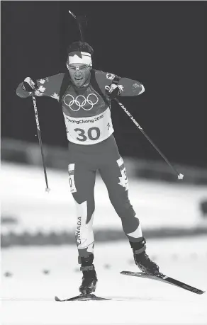  ?? BARON/GETTY IMAGES PHOTO BY LARS ?? Christian Gow of Canada competes during the Men’s 20km Individual Biathlon at the 2018 Winter Olympics in Pyeongchan­g-gun, South Korea.