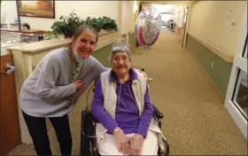  ?? BOB KEELER - MEDIANEWS GROUP ?? Nicole Lashkevich, Elm Terrace Gardens director of life enrichment, and Peg Leichthamm­er pose for a photo March 23on Leighthamm­er’s 106th birthday.