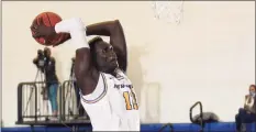  ?? New Haven Athletics / Clarus Multimedia Group ?? Majur Majak, a 7-foot-1 center from South Sudan, has 52 blocks through 17 games and is on pace to break the New Haven single-season record, 75, set by Eric Anderson in 2013-14.