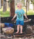  ?? Picture: AAP/DAVID CLARK ?? HANDS ON: Ralphie Moser, 2, gets down and dirty at his home in Mt Tamborine.