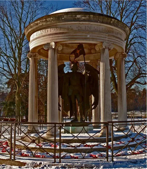  ??  ?? The war memorial in Shrewsbury is like a mini classical temple, sheltering the figure of St Michael.