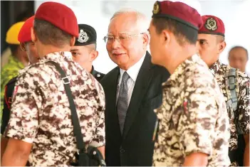  ?? — Bernama photo ?? Najib (centre) arriving at the High Court on Monday for the 1MBD trial.