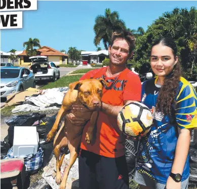  ?? Picture: EVAN MORGAN ?? SLEEPLESS NIGHTS: Peter Walters with daughter Summer, 14, and dog Milly outside their flood damaged home in Idalia. Mr Walters isn’t sure whether to stay in Townsville.