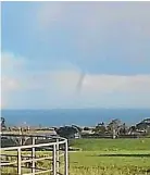  ??  ?? John Karl Erickson photograph­ed this waterspout yesterday morning.