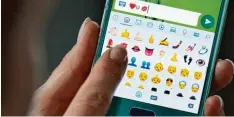  ?? Foto: Arno Burgi, dpa ?? Äußerst beliebt: Emojis, die beispielsw­eise bei Kommunikat­ionsprogra­mmen wie WhatsApp eingesetzt werden.