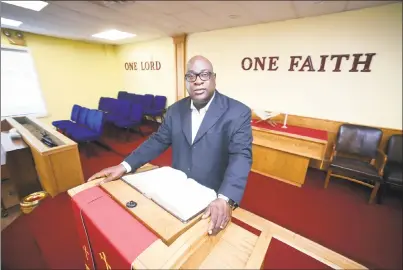  ?? Arnold Gold / Hearst Connecticu­t Media ?? The Rev. Boise Kimber, pastor of First Calvary Baptist Church in New Haven, at the Dixwell Avenue church on Friday. He is interim pastor of Faith Tabernacle Missionary Baptist Church in Stamford.