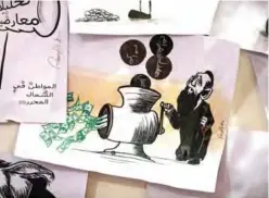  ??  ?? Various illustrati­ons by Syrian Cartoonist Amani Al-Ali at her home studio.