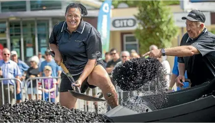  ?? WARWICK SMITH/STUFF ?? Shelley Norris, of Christchur­ch, shovels 200kg of coal in the women’s singles competitio­n at the New Zealand Rural Games in Palmerston North yesterday.