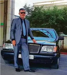  ??  ?? Mohammad Salem Al Shafei with the car of the late Palestinia­n iconic leader Yasser Arafat that he bought.